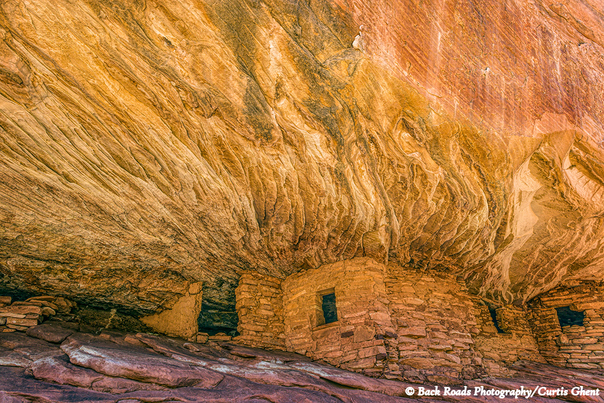 Located under a large caprock the morning light gives the impression that the ruin is on fire.