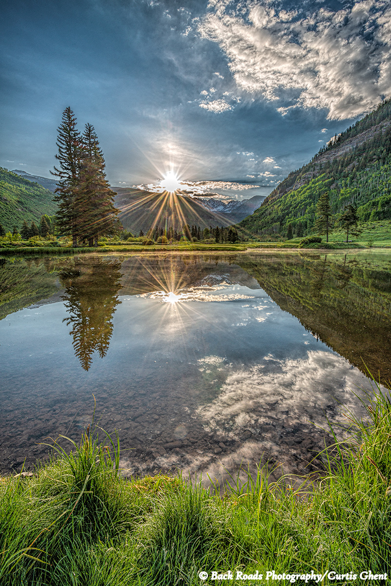 Winds were calm this morning for sunrise over the Gore Range yielding a mirror image.